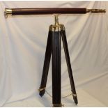 A good quality modern brass and leather mounted telescope on brass mounted folding tripod