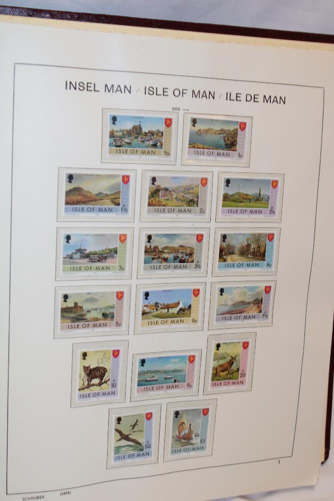 A folder album containing a collection of Channel Islands and Isle of Man stamps including early