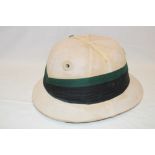 A military tropical helmet by Herbert Johnson of London with green/black pagri and leather liner