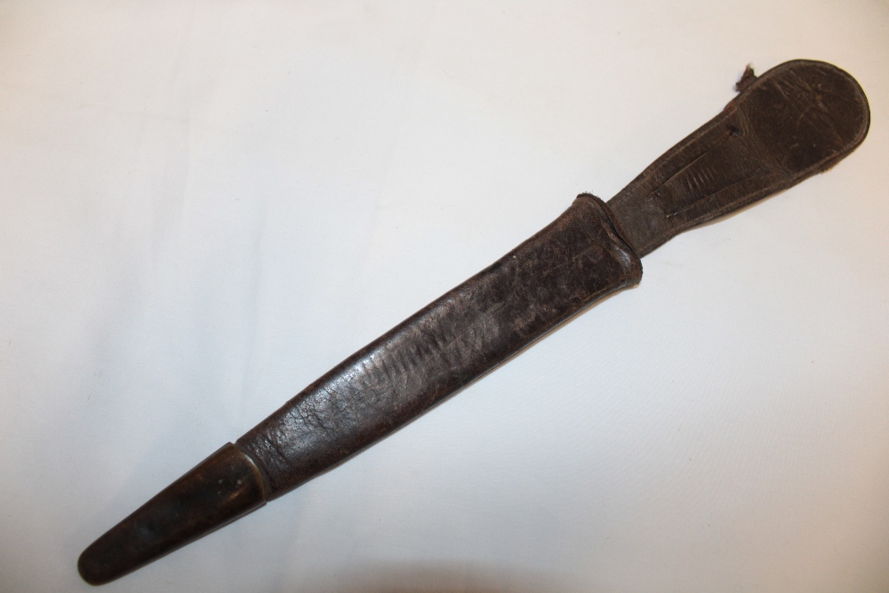 An original Commando dagger leather scabbard with brass mounts