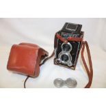 A Mamiyaflex twin lens reflex camera in leather case