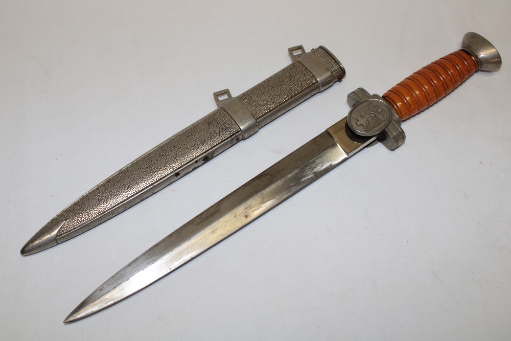 A Second War German Nazi Red Cross Leaders dagger with 10" double edged steel blade,