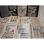 Fourteen albums and stock books containing a selection of mixed World stamps