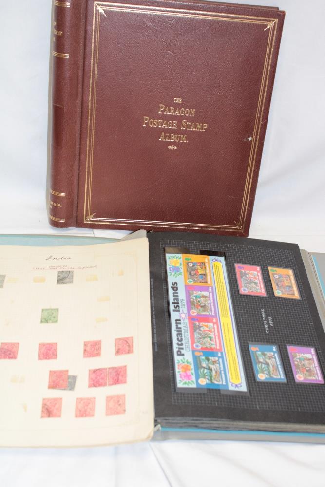 A folder album containing a selection of Pitcairn Islands stamps including numerous mint examples