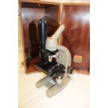 A monocular microscope by Vickers Instruments in fitted wooden case