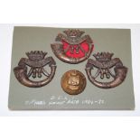 A First War era Officer's bronze cap badge of the DCLI together with a pair of matching full size