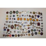 A large selection of various enamelled badges and pin badges including Trade Unions,