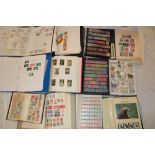 Fourteen albums and stock books containing a large selection of World stamps