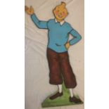 An unusual 1930s/40s painted wood standing advertising figure of the cartoon character "Tintin",
