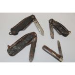 Three various military jack-knives and a folding pocket knife with horn mounts (4)