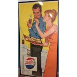 An original 1960's Pepsi-Cola paper advertising poster depicting a male and female at a barbecue