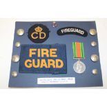 A carded display of Cornwall Civil Defence and Fire Guard insignia formerly the property of Sector