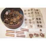 A tin containing various pre-decimal coinage including pennies,