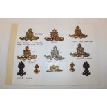 A selection of Artillery cap badges and collars including the First Hants.