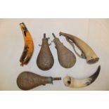 Three various reproduction brass powder flasks with US arms decoration and three cow horn powder