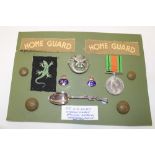 A selection of badges and insignia formerly the property of Pte. G. O.