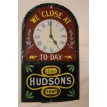 A reproduction enamel arched advertising sign for Hudson's Soap with inset clock face,