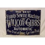 An enamel rectangular sewing machine sign "The Best Family Sewing Machine - Willcox & Gibbs