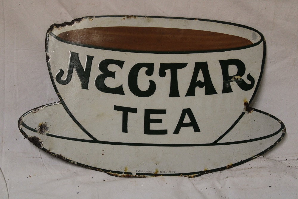 An enamel teacup-shaped advertising sign "Nectar Tea",