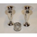 A pair of silver tapered spill vases,