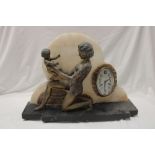 An unusual French Art Deco mantel clock with oval dial set in a cream and brown marble cloud mount