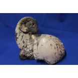 An unusual pottery figure of a recumbent ram,