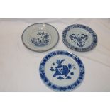 Two 18th century Chinese circular shallow bowls with blue and white floral decoration,