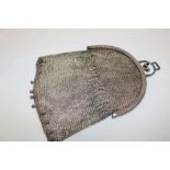 A good quality ladies silvered evening purse with chain mail decoration