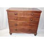 A Victorian mahogany chest of two short and three long drawers with turned handles on turned feet