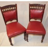 A set of six Victorian carved mahogany dining chairs with upholstered seats and backs on turned