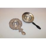 A silver circular tea strainer, Birmingham marks,