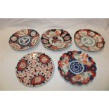 A 19th century Japanese Imari china circular plate with painted floral decoration and four various