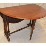 A Victorian walnut oval Sutherland-style drop-leaf tea table on turned supports with castors