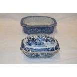 An 18th century Chinese rectangular sauce tureen and cover with blue and white floral and landscape