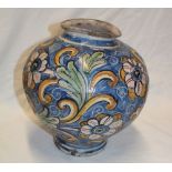 A Middle Eastern pottery circular tapered vase with painted floral decoration,