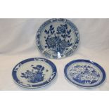Three various 19th century Chinese circular shallow dishes with blue and white painted landscape