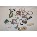 A selection of various costume jewellery including necklaces, brooches, bangles,