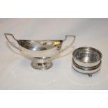 A Continental silver oval two handled pedestal salt and one other Continental silver circular salt
