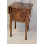 A Victorian rosewood and mahogany drop leaf pot cupboard with compartment enclosed by a single door