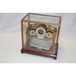 A good quality brass reproduction of a Congreve ball bearing clock with brass and silvered mounts