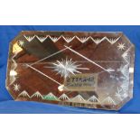 An Art Deco-style bevelled rectangular wall mirror with star-cut decoration,
