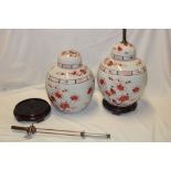 A pair of Chinese circular ginger jars and covers with painted floral decoration, 13" high,
