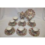 A Royal Winton china chintz pattern coffee set comprising tapered coffee pot, milk jug, sugar basin,