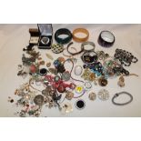 A large selection of various costume jewellery including necklaces, brooches, bangles,