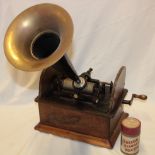 A 19th century Edison phonograph with brass mounted painted metal horn in oak rectangular case with