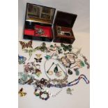 Various boxes containing costume jewellery including butterfly brooches,