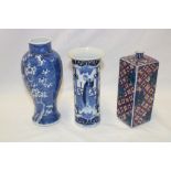 A 19th century Chinese baluster-shaped vase with blossom decoration on blue ground,