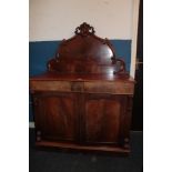 A Victorian mahogany chiffonier with two drawers in the frieze and a cupboard enclosed by two