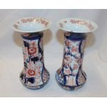 A pair of Japanese Imari pottery tapered vases with blue and red floral decoration,