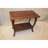 An Eastern carved teak rectangular two tier occasional table with floral decoration edge